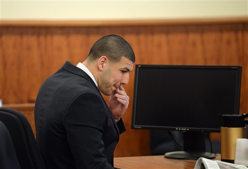 Former New England Patriots football player Aaron Hernandez sits the court room of the Bristol County Superior Court House in Fall River, Mass., after the lunch break. A jury ended deliberations for a second day Wednesday in the murder trial of former New England Patriots player Aaron Hernandez. Hernandez is accused of the murder of Odin Lloyd in June 2013. AP
