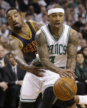 Cleveland Cavaliers guard J.R. Smith, left, keeps pressure on Boston Celtics guard Isaiah Thomas, right, who looks for an opening in the first quarter of a first-round NBA playoff basketball game in Boston, Sunday, April 26, 2015. AP
