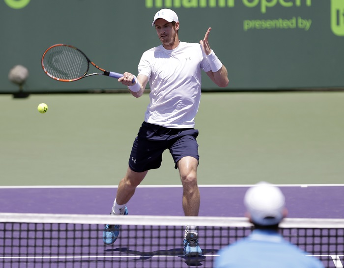 Andy Murray, of Great Britain, returns to Novak Djokovic, of Serbia, during the men's final match at the Miami Open tennis tournament Sunday, April 5, 2015, in Key Biscayne, Fla. AP