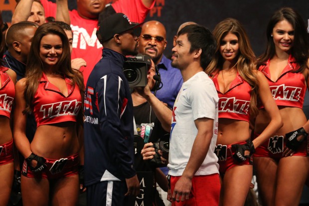 Manny Pacquiao and Floyd Mayweather Jr. after their official weigh in at the MGM Grand in Las Vegas, Nevada on Friday, 1 May 2015. PHOTO BY REM ZAMORA