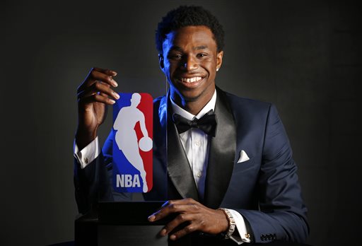 Minnesota Timberwolves' Andrew Wiggins holds his trophy at a news conference after he was named NBA basketball Rookie of the Year, Thursday, April 30, 2015, in Minneapolis. (Brian Mark Peterson/Star Tribune via AP) 