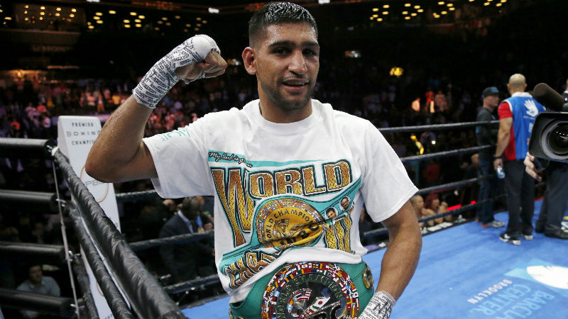 Amir Khan celebrates after defeating Chris Algieri during a boxing bout, Friday, May 29, 2015, in New York. Khan won by unanimous decision. (AP Photo/Julio Cortez)