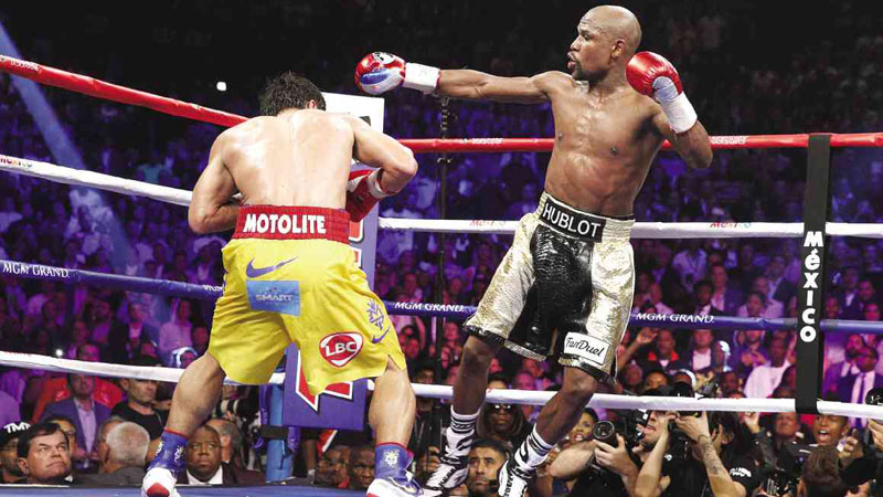 HE COULD HAVE DANCED ALL NIGHT  Manny Pacquiao bores in against smooth dancer Floyd Mayweather Jr. during their catch-me-if-you-can encounter at the MGM Grand Garden Arena in Las Vegas, Nevada.  AFP