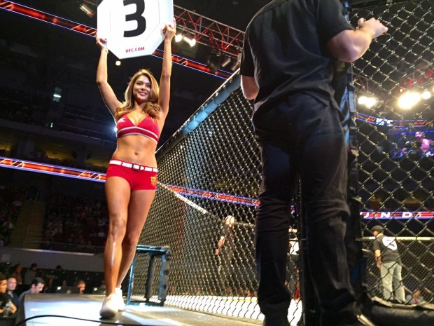 Octagon girl Arianny Celeste holds a card during the UFC Fight Night in Manila Saturday night at the Mall of Asia Arena.