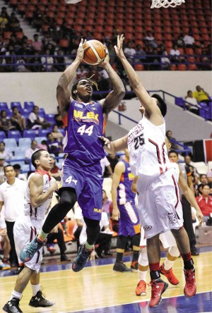 NLEX import Kwame Alexander puts up a shot off Kyle Pascual of Kia in yesterday’s game at Ynares Arena in Antipolo. AUGUST DELA CRUZ