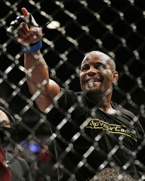Daniel Cormier celebrates after defeating Anthony Johnson in their light heavyweight mixed martial arts title bout at UFC 187 on Saturday, May 23, 2015, in Las Vegas. (AP Photo/John Locher)