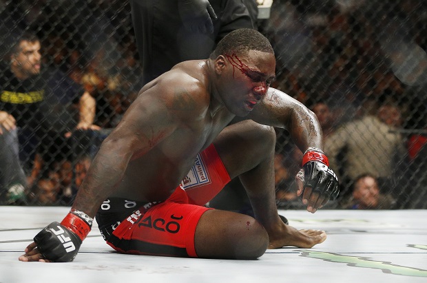 Anthony Johnson sits on the mat after the second round in a light heavyweight title mixed martial arts bout against Daniel Cormier at UFC 187 on Saturday, May 23, 2015, in Las Vegas. (AP Photo/John Locher)