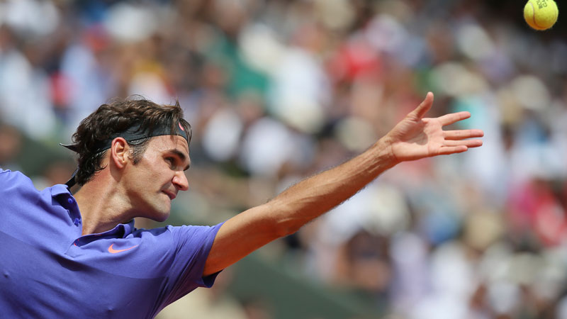 Switzerland's Roger Federer serves in the first round match of the French Open tennis tournament against Colombia's Alejandro Falla at the Roland Garros stadium, in Paris, France, Sunday, May 24, 2015. Federer won in three sets 6-3, 6-3. 6-4. (AP Photo/David Vincent)