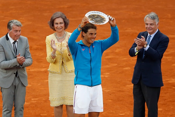 Rafael Nadal of Spain lifts his second place trophy  at the end of the final of the Madrid Open Tennis tournament in Madrid, Spain, Sunday, May 10, 2015. Andy Murray of Great Britain defeated Nadal 6/3, 6/2. AP