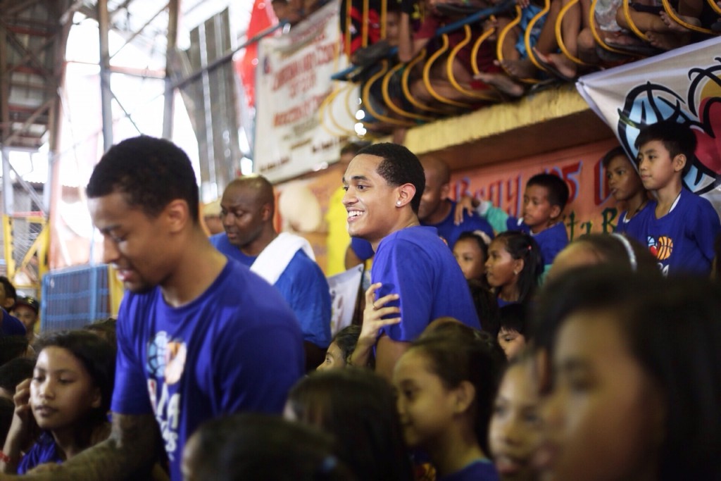 Jordan Clarkson, Trey Burke, and Horace Grant interact with kids at the NBA event in Tondo, Manila. Photo by Tristan Tamayo/INQUIRER.net 