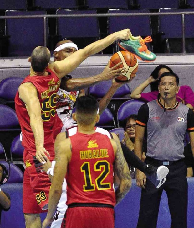 RICO Maierhoffer of Barako Bull finds good use for his shoe, using it to thwart an attempt by San Miguel Beer’s Gabby Espinas.  AUGUST DELA CRUZ 