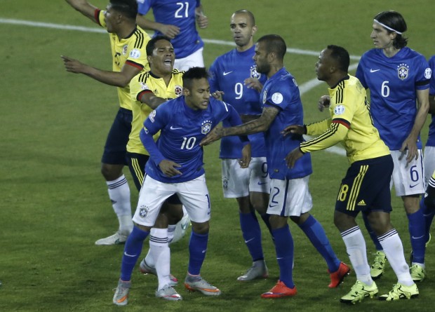 Colombia's Carlos Bacca, second left, pushes Brazil's Neymar, 10, during a scuffle at the end of a Copa America Group C soccer match at the Monumental stadium in Santiago, Chile, Wednesday, June 17, 2015. Colombia won the match 1-0.  (AP Photo/Silvia Izquierdo)