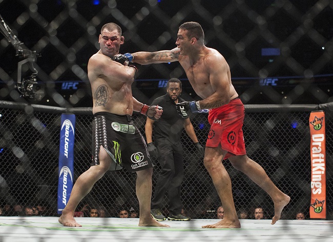 Brazil's Fabricio Werdum lands a punch to United States' Cain Velasquez during a heavyweight mixed martial arts title bout at UFC 188 in Mexico City, Saturday, June 13, 2015. Werdum won the fight by submission. AP