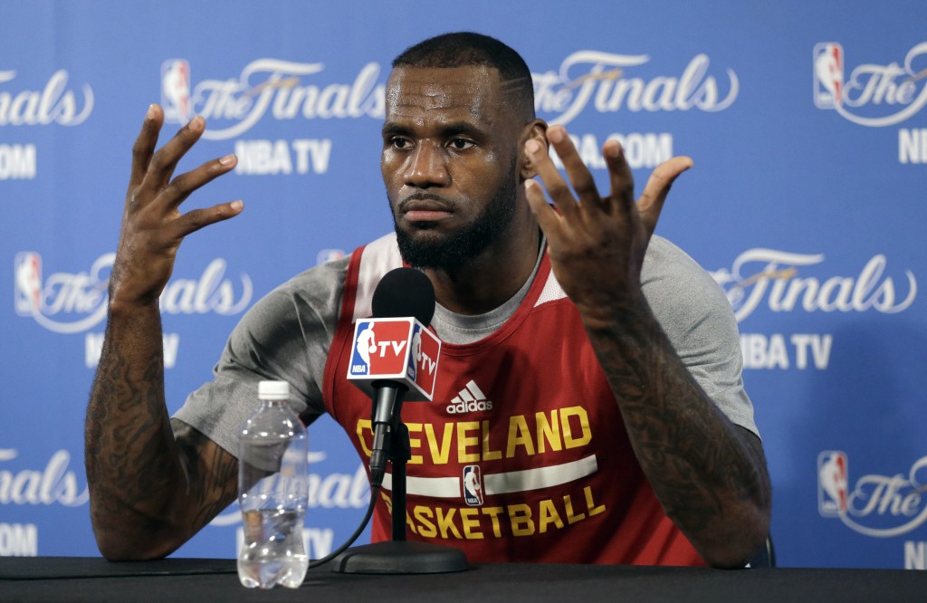 Cleveland Cavaliers' LeBron James gestures during an NBA basketball media conference on Friday, June 5, 2015, in Oakland, Calif. The Golden State Warriors host the Cavaliers in Game 2 of the NBA Finals on Sunday. (AP Photo/Ben Margot)