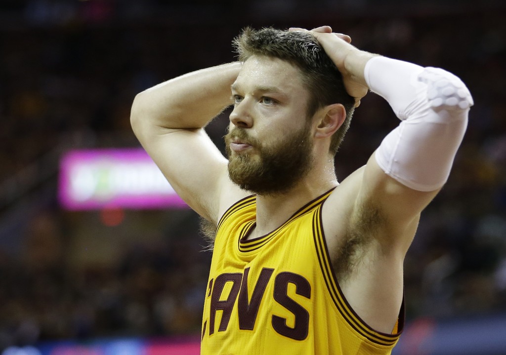 Cleveland Cavaliers guard Matthew Dellavedova (8) walks on the court during the second half of Game 4 of basketball's NBA Finals against the Golden State Warriors in Cleveland, Thursday, June 11, 2015. (AP Photo/Tony Dejak)