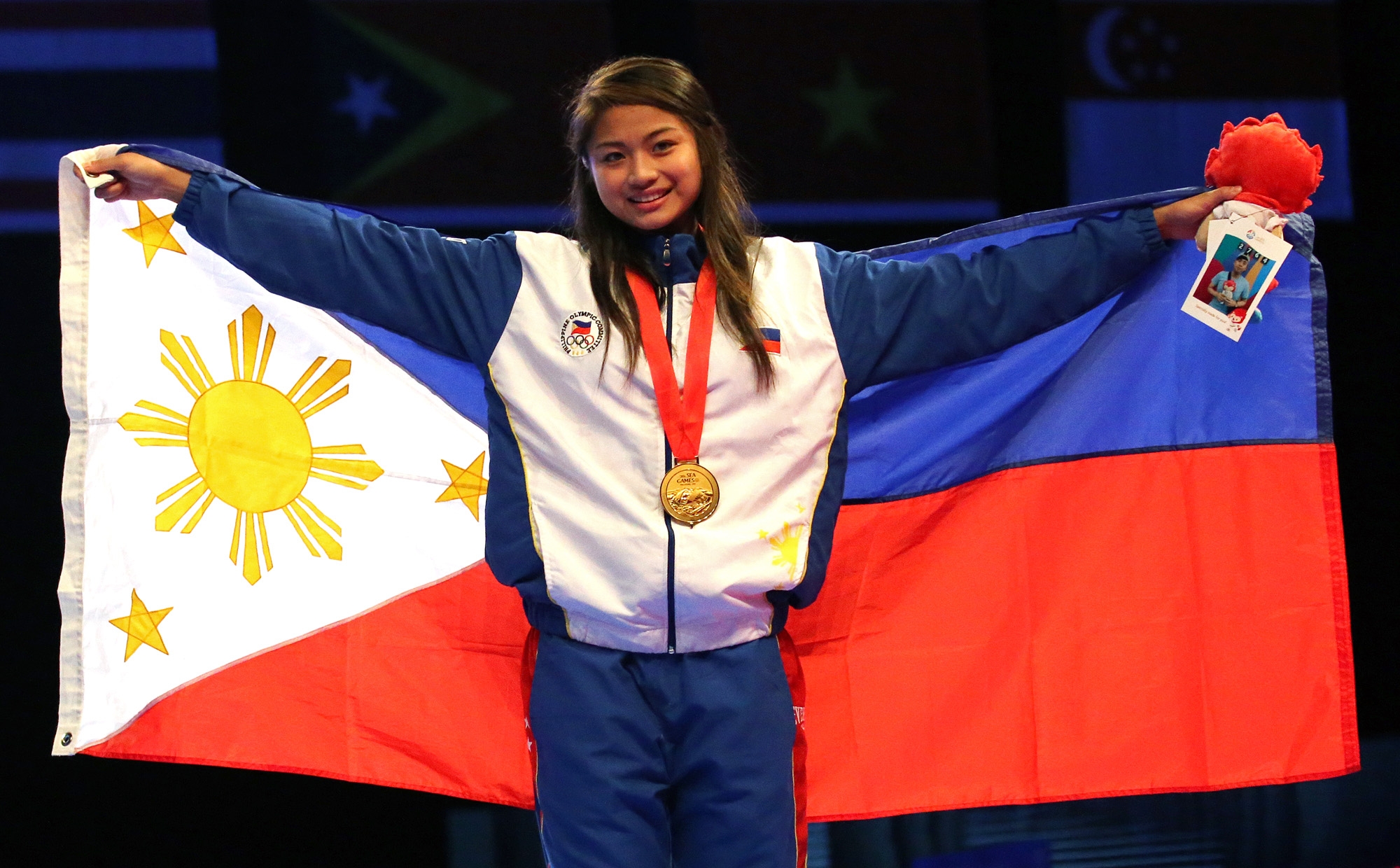 Gold medalist Pauline Lopez of the Philippines during the 28th SEA Games womens under 57kg final held at the Singapore Expo Hall 2  after defeating Thi Thu Hien Pham of Vietnam. INQUIRER PHOTO/RAFFY LERMA