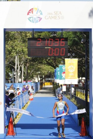 Filipina triathlete Claire Adorna finishes first in the triathlon event of the 2015 Southeast Asian Games in Singapore. 