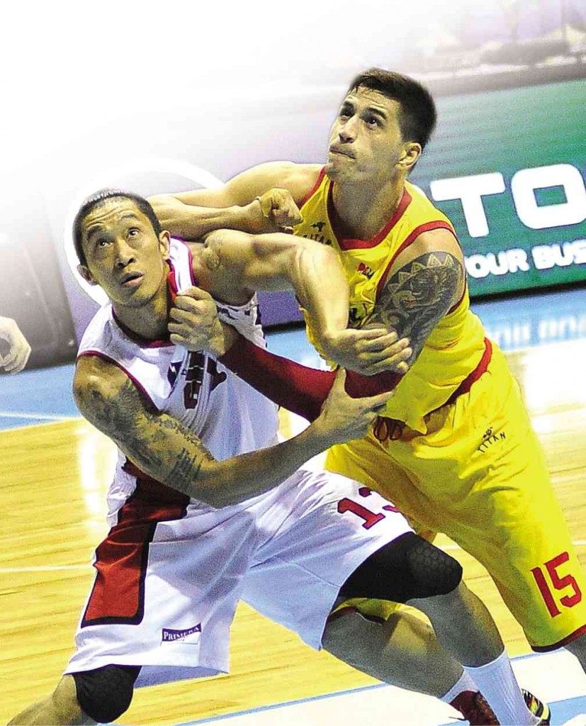 JAYJAY Helterbrand of Ginebra and Marc Pingris of Star  battle for the rebound in yesterday’s match at  Smart Araneta Coliseum.  AUGUST DELA CRUZ 