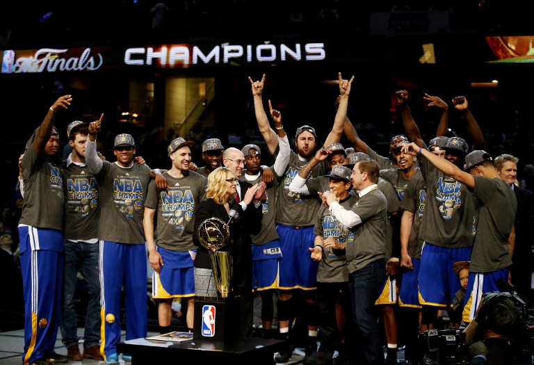 CLEVELAND, OH - JUNE 16: The Golden State Warriors celebrates with the Larry O'Brien NBA Championship Trophy after winning Game Six of the 2015 NBA Finals against the Cleveland Cavaliers at Quicken Loans Arena on June 16, 2015 in Cleveland, Ohio. NOTE TO USER: User expressly acknowledges and agrees that, by downloading and or using this photograph, user is consenting to the terms and conditions of Getty Images License Agreement.   Ezra Shaw/Getty Images/AFP