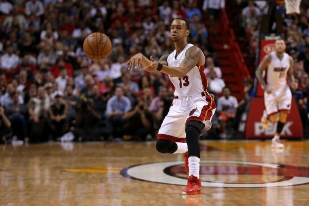 Shabazz Napier #13 of the Miami Heat passes during a game against the Philadelphia 76ers at American Airlines Arena on February 23, 2015 in Miami, Florida. Mike Ehrmann/Getty Images/AFP