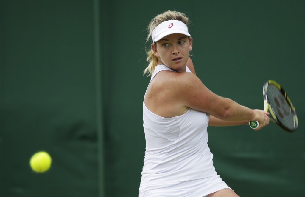 Coco Vandeweghe of the United States returns a shot to Karolina Pliskova of the Czech Republic during the women's singles match, at the All England Lawn Tennis Championships in Wimbledon, London, Wednesday July 1, 2015. AP