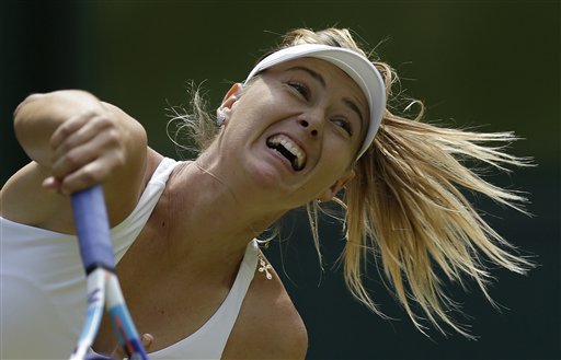Maria Sharapova of Russia returns a ball to Coco Vandeweghe of the United States  during their singles match at the All England Lawn Tennis Championships in Wimbledon, London, Tuesday July 7, 2015. (AP Photo/Pavel Golovkin)