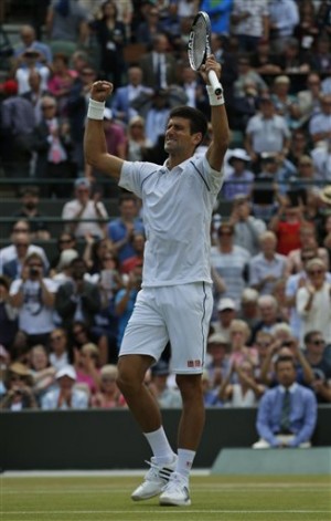 Novak Djokovic of Serbia celebrates winning the singles match against Kevin Anderson of South Africa, at the All England Lawn Tennis Championships in Wimbledon, London, Tuesday July 7, 2015. Djokovic won 6-7, 6-7, 6-1, 6-4, 7-5. AP