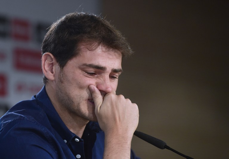 Real Madrid's goalkeeper Iker Casillas cries as he gives a press conference at the Santiago Bernabeu stadium in Madrid on July 12, 2015. Real Madrid's emblematic captain and goalkeeper Iker Casillas is set to leave the club for FC Porto after 25 years during which he won everything in the game with the Spanish giants.   AFP PHOTO/ PIERRE-PHILIPPE MARCOU