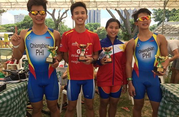 The four Cebuano junior triathletes who took the Singapore International Triathlon by storm with their trophies (from left) Justin Chiongbian (16-19 gold), Ralph Eduard So (14-15 bronze), Aaliyah Mataragnon (14-15 bronze) and Yuan Chiongbian (14-15 gold).  CONTRIBUTED PHOTO/Cebu Daily News