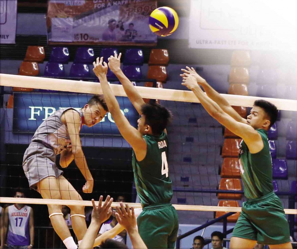 ARELLANO U’s Sanny Sarino unleashes a powerful spike against St. Benilde’s Isaah Arda (4) as Blazer Francis Basilan tries to provide help during their Spikers’ Turf clash at The Arena.