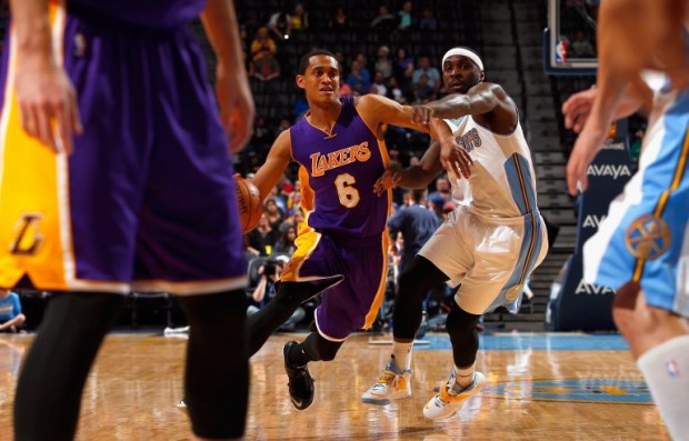DENVER, CO - APRIL 08: Jordan Clarkson #6 of the Los Angeles Lakers controls the ball against Ty Lawson #3 of the Denver Nuggets at Pepsi Center on April 8, 2015 in Denver, Colorado. The Nuggets defeated the Lakers 119-101. NOTE TO USER: User expressly acknowledges and agrees that, by downloading and or using this photograph, User is consenting to the terms and conditions of the Getty Images License Agreement.   Doug Pensinger/Getty Images/AFP