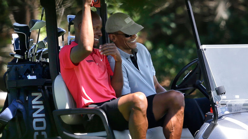 NBA Basketball player Ray Allen, left, and President Barack Obama talk as they sit in a cart while golfing, Wednesday, Aug. 12, 2015, at Farm Neck Golf Club, in Oak Bluffs, Mass., on the island of Martha's Vineyard. The president, first lady Michelle Obama, and daughter Sasha are vacationing on the island. (AP Photo/Steven Senne)