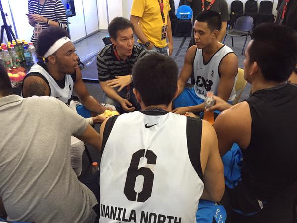 Coach Eric Altamirano talking to Manila North players. Photo by Mark Giongco/INQUIRER.net