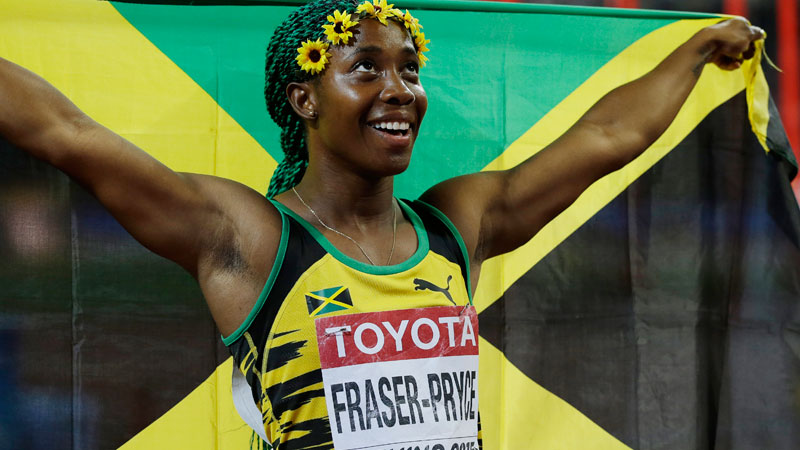 Jamaica's Shelly-Ann Fraser-Pryce celebrates after winning the gold medal in the women’s 100m at the World Athletics Championships at the Bird's Nest stadium in Beijing, Monday, Aug. 24, 2015. (AP Photo/Kin Cheung)
