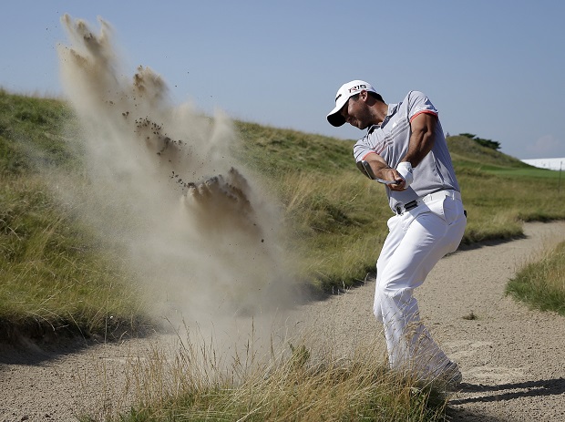 Jason Day, of Australia, hits out of a bunker on the second hole during the third round of the PGA Championship golf tournament Saturday, Aug. 15, 2015, at Whistling Straits in Haven, Wis. (AP Photo/Jae Hong)