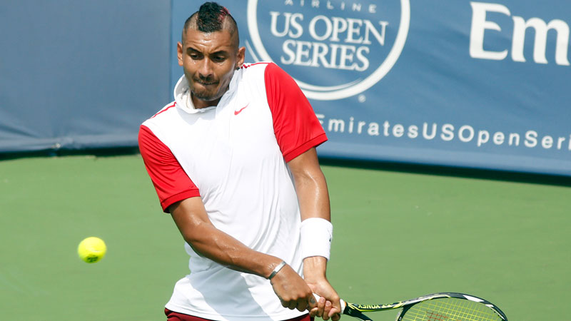 Nick Kyrgios, of Australia, returns to Richard Gasquet, of France, during a first round match at the Western & Southern Open tennis tournament, Tuesday, Aug. 18, 2015, in Mason, Ohio. (AP Photo/David Kohl)