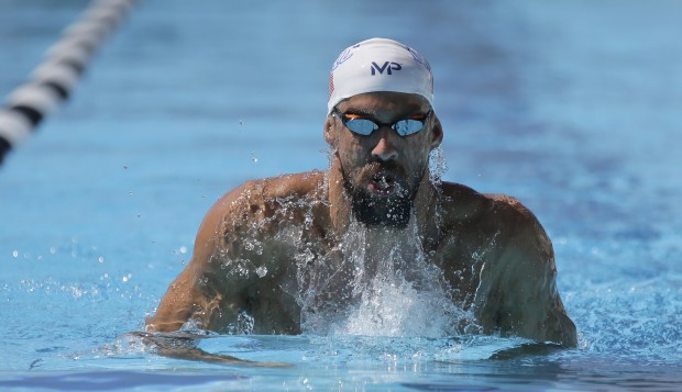 Michael Phelps practices for the U.S. swimming national championships Wednesday, Aug. 5, 2015, in San Antonio, Tex. Phelps, who is scheduled to compete in four events, says he plans to shave his beard before he competes Friday. (AP Photo/Eric Gay)