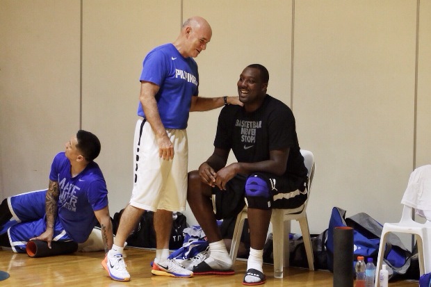 Coach Tab Baldwin talking to naturalized player Andray Blatche.