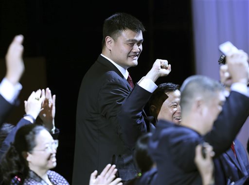 Yao Ming celebrates with Chinese participants after China was awarded the 2019 FIBA Basketball World Cup defeating the Philippines during a 2019 FIBA Basketball World Cup host announcement ceremony in Tokyo, Friday, Aug. 7, 2015. AP
