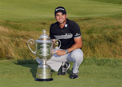 Jason Day, of Australia, poses with the Wanamaker Trophy after winning the PGA Championship golf tournament Sunday, Aug. 16, 2015, at Whistling Straits in Haven, Wis. AP PHOTO