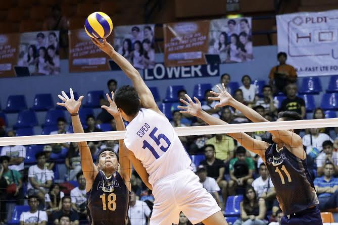 Ateneo's Marck Espejo (15) rises over a couple of National University blockers. Tristan Tamayo/INQUIRER.net