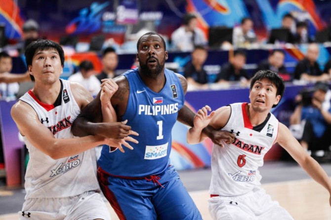 A couple of Japanese players try to keep Gilas big man Andray Blatche (1) from getting the rebound. Photo from Fiba.com