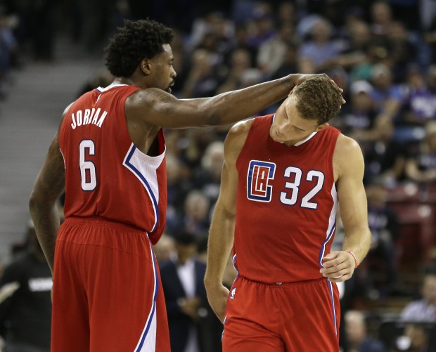 Los Angeles Clippers center DeAndre Jordan, left, gives teammate Los Angeles Clippers forward Blake Griffin a pat afterr he scored late in the fourth quarter against the Sacramento Kings in an NBA basketball game in Sacramento, Calif., Wednesday, Oct. 28, 2015. The Clippers won 111-104. (AP Photo/Rich Pedroncelli)