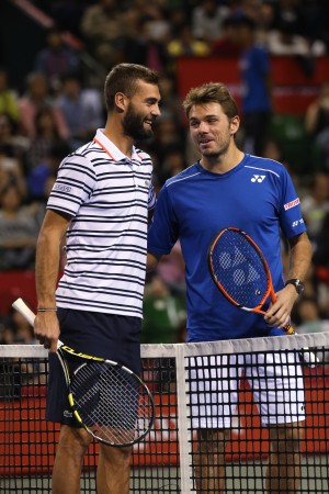 Stan Wawrinka of Switzerland, right, and Benoit Paire of France, left, greet each other prior to their championship match of the Japan Open mens tennis tournament in Tokyo, Sunday, Oct. 11, 2015. (AP Photo/Eugene Hoshiko)