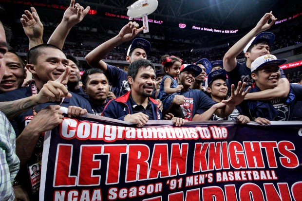 Letran team manager Manny Pacquiao celebrates after the Knights win the NCAA championship. Photo by Tristan Tamayo/INQUIRER.net