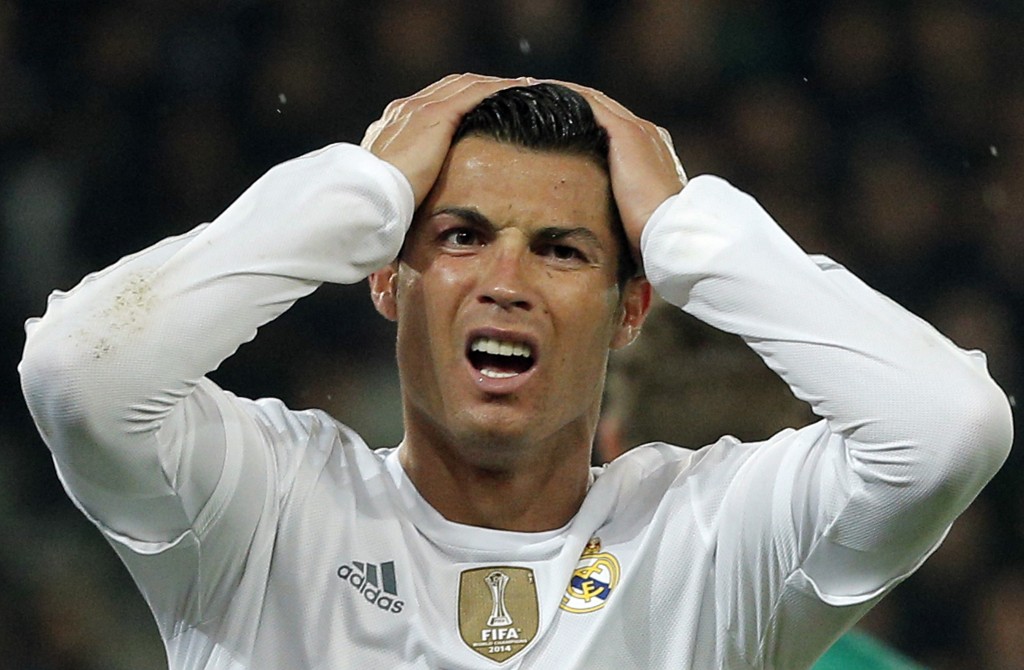 Real Madrid's Cristiano Ronaldo reacts after missing a goal during the Champions League group A soccer match between Paris St Germain and Real Madrid at the Parc des Princes stadium in Paris, Wednesday, Oct. 21, 2015. (AP Photo/Thibault Camus)