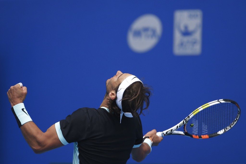 Rafael Nadal of Spain reacts after defeating Fabio Fognini of Italy in the men's singles semifinals match of the China Open tennis tournament at the National Tennis Stadium in Beijing, Saturday, Oct. 10, 2015. (AP Photo/Andy Wong)