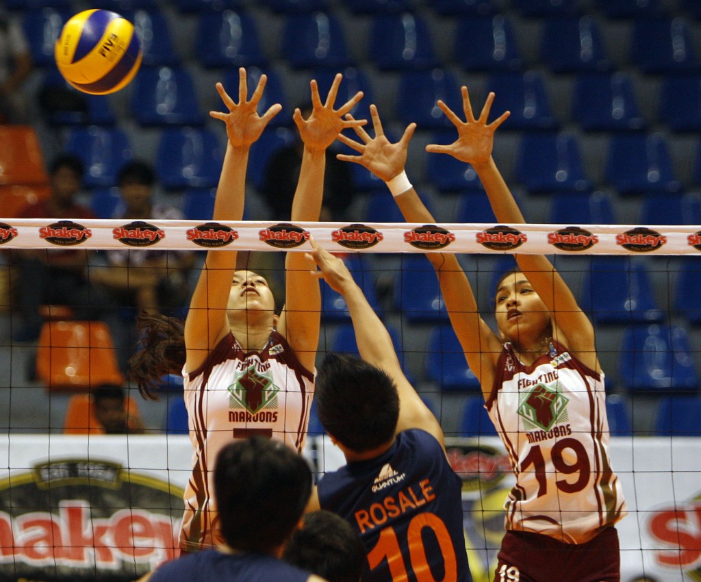 UP’s tough defense put up by Mae Chopitea (7) and Nicole Tiamzon during their Shakey’s V-League Reinforced Conference showdown.