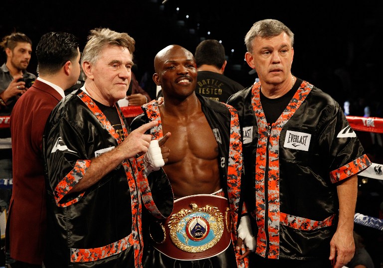 LAS VEGAS, NV - NOVEMBER 07: WBO welterweight champion Timothy Bradley Jr. (C) poses with cutman Malcolm Garrett (L) and trainer Teddy Atlas after defeating Brandon Rios in a title fight at the Thomas & Mack Center on November 7, 2015 in Las Vegas, Nevada.   Steve Marcus/Getty Images/AFP