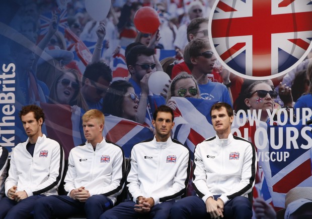 The British Davis cup players from the left, Andy Murray, Kyle Edmund James Ward and Jamie Murray sit on stage as the draw ceremony takes place for the Davis Cup Final tennis match between Belgium and Britain, in Ghent, Belgium, Thursday, Nov. 26, 2015. The final starts Friday and runs till Sunday. (AP Photo/Alastair Grant)